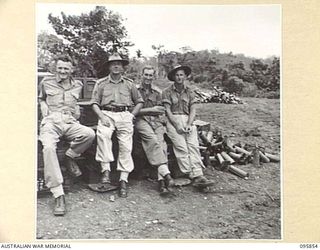 BORAM, WEWAK AREA, NEW GUINEA. 1945-08-31. MEMBERS OF 2/3 FIELD REGIMENT, ROYAL AUSTRALIAN ARTILLERY. IDENTIFIED PERSONNEL ARE:- LIEUTENANT R.B. HUNT (1); WARRANT OFFICER 1 F. MUSIN (2); LIEUTENANT ..