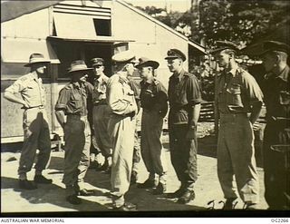 TOROKINA, BOUGAINVILLE ISLAND, SOLOMON ISLANDS. 1945-02-18. CHIEF OF AIR STAFF AIR VICE-MARSHAL JONES CB CBE DFC (CENTRE) INSPECTS PILOTS OF NO. 5 (TACTICAL RECONNAISSANCE) SQUADRON RAAF. 469 ..