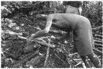 Folofo'u, secondary priest of Kwailala'e, preparing the sacrificial fire