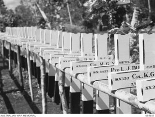 SOPUTA, NEW GUINEA, 1943-07-20. FRESHLY PAINTED CROSSES ON A DRYING RACK, AT THE SOPUTA WAR CEMETERY. THE 15TH AUSTRALIAN WAR GRAVES REGISTER AND ENQUIRY UNIT IS RESPONSIBLE FOR ALL WORK AT THE ..