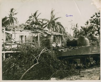 Marine tank investigating sniper's hideout