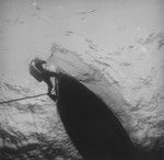 Diver at the surface near a boat, Alexa Bank, Samoa