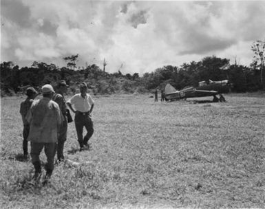 This is the anniversary [?] in which I landed on the KARA airstrip s'Bpile [?]. It was the second aust plane to land, there had been one the previous day, I was the first n-z to see the place from the ground. These are the "reception" party.