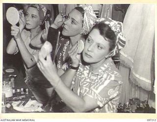 WEWAK POINT, NEW GUINEA. 1945-09-28. MEMBERS OF THE DARYA COLLIN BALLET TROUPE MAKING UP IN THE DRESSING ROOM BEFORE THEIR PERFORMANCE AT THE THEATRE ERECTED AT HEADQUARTERS 6 DIVISION. IDENTIFIED ..