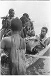 Trading with saltwater (coastal) women in the canoes