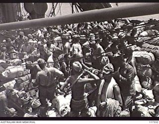 NAURU ISLAND. 1945-09-18. JAPANESE POWS ON THE DECKS OF THE RAN VESSEL, THE HMAS GLENELG, DURING THEIR EVACUATION TO BOUGAINVILLE SOON AFTER TROOPS OF THE 31/51ST AUSTRALIAN INFANTRY BATTALION TOOK ..