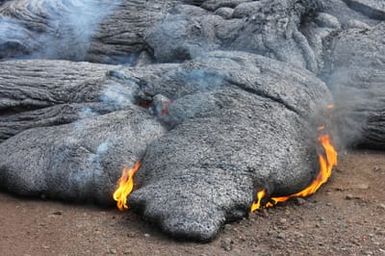 Pupu &lsquoō lava flows and burns near Pahoa, Hawaii as a result of Kilauea Volcano eruption in June 2014.