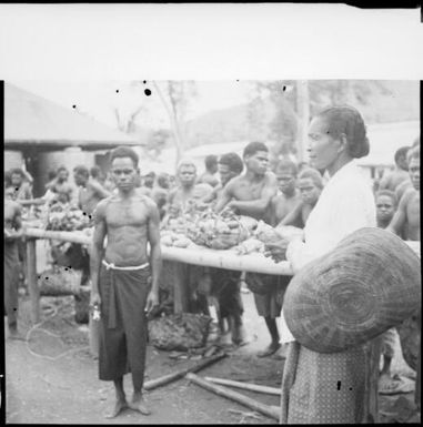 Boong Malay woman carrying a basket, Boong, native market, Rabaul, New Guinea, ca. 1929 / Sarah Chinnery