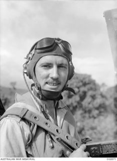 MILNE BAY, PAPUA. 1943-07-15. INFORMAL PORTRAIT OF FLIGHT LIEUTENANT B. E. (BUSTER) BROWN OF WILBERFORCE, NSW, IN HIS HEADGEAR, A MEMBER OF NO. 75 (FIGHTER) SQUADRON RAAF OPERATING FROM MILNE BAY