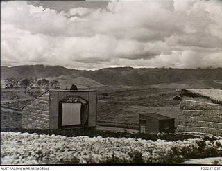 Garoka, New Guinea, 1945-11. The makeshift outdoors cinema (left) at the RAAF Aircrew Rest Camp known as 'Lamana', meaning 'Eternal Springs', which is located in the highlands at an altitude of ..