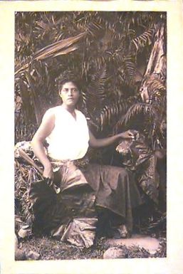 Woman in Bush with Oily Leaf