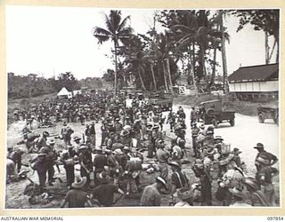 BORAM BEACH, NEW GUINEA. 1945-10-13. THE FIRST BATCH OF TROOPS TO LEAVE THE WEWAK AREA UNDER THE PRIORITY DEMOBILISATION SCHEME WERE MEMBERS OF 6 DIVISION. SHOWN, THE GENERAL EMBARKATION ACTIVITY ..