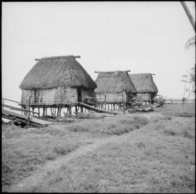 Traditional huts built over the water's edge, Naboutini, Fiji, 1966 / Michael Terry