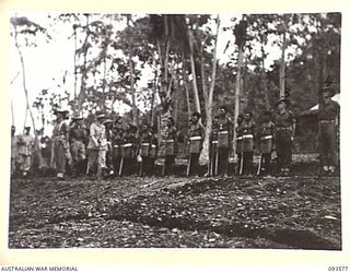 TOL PLANTATION, WIDE BAY, NEW BRITAIN. 1945-07-02. HIS ROYAL HIGHNESS, THE DUKE OF GLOUCESTER, GOVERNOR GENERAL OF AUSTRALIA (5), AND OFFICIAL PARTY, INSPECTING NATIVE SOLDIERS OF 5 PLATOON, A ..