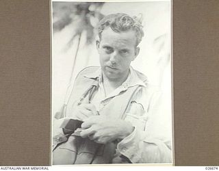 MILNE BAY, PAPUA. 1942-09. FLYING OFFICER J.C. WHITING SERVING WITH 76 FIGHTER SQUADRON RAAF IN NEW GUINEA