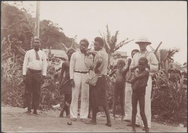 Bishop Wilson with village men and boys at Buala, Solomon Islands, 1906 / J.W. Beattie