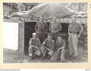 SORAKEN, BOUGAINVILLE. 1945-06-05. THE STAFF OUTSIDE 12 BATTERY, 4 FIELD REGIMENT COMMAND POST AT H BEACH. IDENTIFIED PERSONNEL ARE:- LANCE SERGEANT J. HOSIE (1); SERGEANT A.J. MCKEAN (2); ..