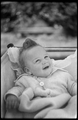 Ray Hare in a bassinet