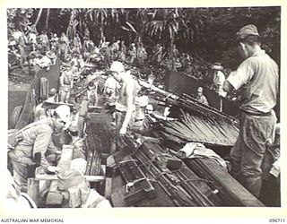 KAIRIRU ISLAND, NEW GUINEA. 1945-09-17. FOLLOWING THE SURRENDER ALL JAPANESE NAVAL PERSONNEL ON KAIRIRU ISLAND WERE TRANSFERRED TO MUSCHU ISLAND. THE JAPANESE HAD A LARGE AMOUNT OF BELONGINGS AND ..