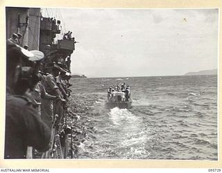 AT SEA OFF RABAUL, NEW BRITAIN. 1945-09-04. JAPANESE NAVAL LAUNCH MOVING AWAY FROM HMAS VENDETTA, AFTER PRE- SURRENDER DISCUSSIONS ABOARD HMAS VENDETTA AT A SEA RENDEZVOUS OFF RABAUL BETWEEN ..