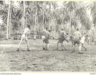 MILILAT, NEW GUINEA. 1944-08-31. AN EXCITING INCIDENT DURING THE SOCCER MATCH BETWEEN SINGLE AND MARRIED MEN OF THE 5TH DIVISION SIGNALS