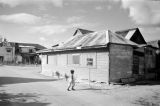 Guam, boy walking in village 'school zone'