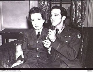 LAE, NEW GUINEA, 1945-12-18. SERGEANT R. G. G. FOLKARD, (MULVANEY) (2) AND CORPORAL P. M. RHODES, (LADY ELIZABETH) (1), PLAYERS OF DETACHMENT 12 ENTERTAINMENT UNIT, IN A SCENE FROM THE WAR-TIME ..