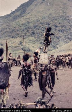 Mendi person wearing woven headpiece