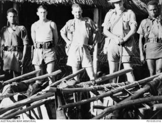 Wabag, New Guinea. A group of spotters with the New Guinea Air Warning Wireless Company (NGAWW) about to leave their station for the Pumunda-Sau River area. Left to right: unidentified policeman of ..