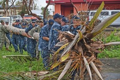 SAIPAN - Sailors from USS Ashland and Marines from the 31st MEU help remove debris on Saipan. Photo by MC3 David Cox.