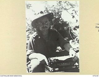 MILILAT, NEW GUINEA. 1944-08-13. NX15943 LIEUTENANT J.S. CLEARY, MILITARY HISTORY SECTION TYPING HIS DESPATCH TO BE SENT BACK TO THE MAINLAND