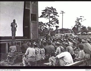LAE, NEW GUINEA, 1946-01-28. THE HONOURABLE F. M. FORDE, MINISTER FOR THE ARMY, WHO IS ON AN INSPECTION TOUR OF AUSTRALIAN UNITS IN THE LAE AREA SHOWN ADDRESSING TROOPS AT THE OTHER RANKS' CLUB. ..