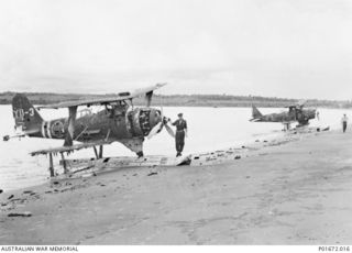 REKATA BAY, SANTA ISABEL ISLAND, SOLOMON ISLANDS, 1944-03. TWO DAMAGED MITSUBISHI F1M2 ("PETE") OBSERVATION SEAPLANES BEACHED AT REKATA BAY ON THE NORTHERN END OF SANTA ISABEL ISLAND. THE MAN ..