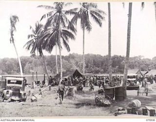 HANSA BAY, NEW GUINEA. 1944-09-07. PERSONNEL OF HEADQUARTERS B COMPANY, 25TH INFANTRY BATTALION LINE UP DURING A UNIT MESS PARADE