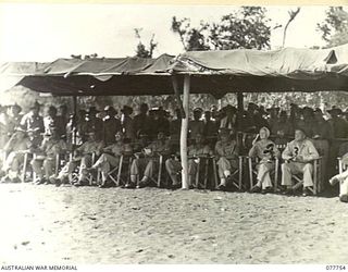 MALAHANG BEACH, LAE, NEW GUINEA. 1944-12-31. THE OFFICIAL STAND DURING THE CHRISTMAS SURF CARNIVAL ORGANISED BY NX26061 CAPTAIN R.W. DIBBIN, DEPUTY ASSISTANT DIRECTOR OF ORDNANCE SERVICES, LAE BASE ..