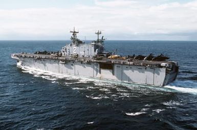 A port quarter view of the amphibious assault ship USS SAIPAN (LHA 2) underway during NATO Exercise NORTHERN WEDDING 86