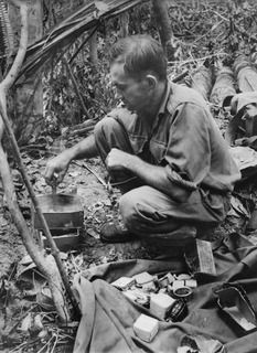 1943-09-20. NEW GUINEA. FOOD IN THE FRONT LINE. PRACTICAL EVIDENCE OF THE WORK OF OPERATIVES IN PREPARING SPECIAL PACKS FOR TROOPS OPERATING IN FORWARD JUNGLE AREAS. TAKEN AT GOODVIEW JUNCTION THIS ..