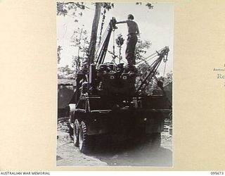 BOUGAINVILLE. 1945-08-30. A BREAKDOWN TRUCK TRANSPORTING THE ENGINE OF A MATILDA TANK, REPAIRED BY 2/4 ARMOURED REGIMENT WORKSHOP, NOW READY FOR REPLACEMENT