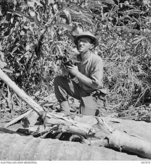NEW GUINEA. 1944-07. NX95472 LIEUTENANT F.S. WOOD, CINEMATOGRAPHER OF THE MILITARY HISTORY SECTION