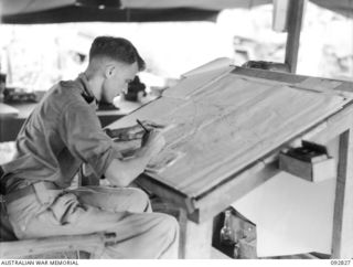WEWAK AREA, NEW GUINEA, 1945-06-05. F-SGT K. PROWSE, 3 MOBILE METEOROLOGICAL FLIGHT, RAAF, ATTACHED HQ ROYAL AUSTRALIAN ARTILLERY 6 DIVISION, PLOTTING THE WEATHER CHART FOR FORECASTING PURPOSES. ..