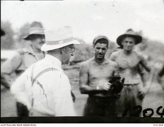 AITAPE, NORTH EAST NEW GUINEA. C. 1944-06. ARTHUR DRAKEFORD, THE MINISTER FOR AIR, TALKING TO RAAF PERSONNEL DURING HIS VISIT TO RAAF UNITS IN THE NEW GUINEA AREA