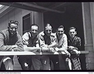 HEIDELBERG, VIC. 1944-01-15. FIVE WOUNDED SOLDIERS RECENTLY EVACUATED FROM NEW GUINEA ON ONE OF THE VERANDAHS AT THE 115TH MILITARY HOSPITAL. LEFT TO RIGHT: CORPORAL R. A. LUCAS; SERGEANT E. G. ..