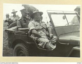 TOKO, SOUTH BOUGAINVILLE. 1945-03-26. VX1 GENERAL SIR THOMAS BLAMEY, GBE, KCB, CMG, DSO, ED, COMMANDER- IN- CHIEF, ALLIED LAND FORCES, SOUTH WEST PACIFIC AREA (1), ACCOMPANIED BY VX38969 MAJOR- ..