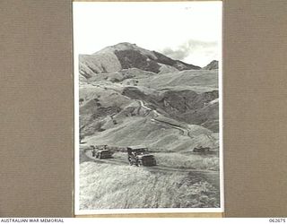 LAKE ROAD, FINISTERRE RANGES, NEW GUINEA. 1943-12-21. A SECTION OF LAKE ROAD IN THE FOOTHILLS OF THE FINISTERRE RANGES WHICH WAS BUILT BY THE ROYAL AUSTRALIAN ENGINEER UNITS OF THE 7TH AUSTRALIAN ..