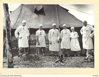 WUNUNG PLANTATION, JACQUINOT BAY, NEW BRITAIN. 1945-03-02. THE OPERATING THEATRE STAFF OF THE 105TH CASUALTY CLEARING STATION OUTSIDE THE THEATRE BETWEEN OPERATIONS. IDENTIFIED PERSONNEL ..