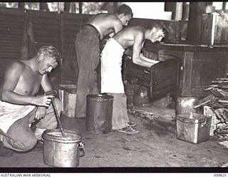 LAE, NEW GUINEA, 1946-01-09. COOKS OF AUSTRALIAN ARMY CANTEENS SERVICE BULK STORES. IDENTIFIED PERSONNEL ARE: SERGEANT C. A. MARSTON (1), PRIVATE W. A. PARKWOOD (2), PRIVATE K. B. NEVILLE (3)