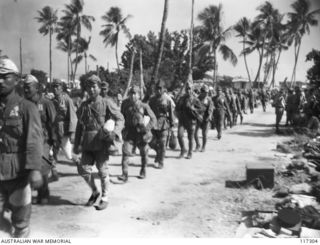 NAURU ISLAND, 1945-09-16. JAPANESE PRISONERS OF WAR MOVING TO THE WHARF FOR EVACUATION TO BOUGAINVILLE SOON AFTER TROOPS OF THE 31/51ST AUSTRALIAN INFANTRY BATTALION TOOK OVER THE ISLAND