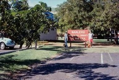 [Evelyn F. Streng and Woman at Naalehu Sign]