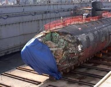 FILE (NYT29) APRA HARBOR, Guam -- May 17, 2005 -- SUBMARINE-CRASH-2 -- A U.S. Navy photo of the submarine USS San Francisco as it sat dry dock in Guam, Jan. 27, 2005 where the damage to its bow following a collision with an undersea mountain was being ass