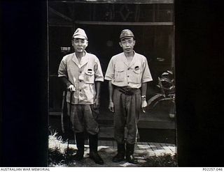 Lesson Point, Rabaul, New Britain, 1945-10. Informal outdoors portrait of two senior officers of the Imperial Japanese Navy, Rear Admiral Sato (left) and Commander Hori, standing in front of the ..